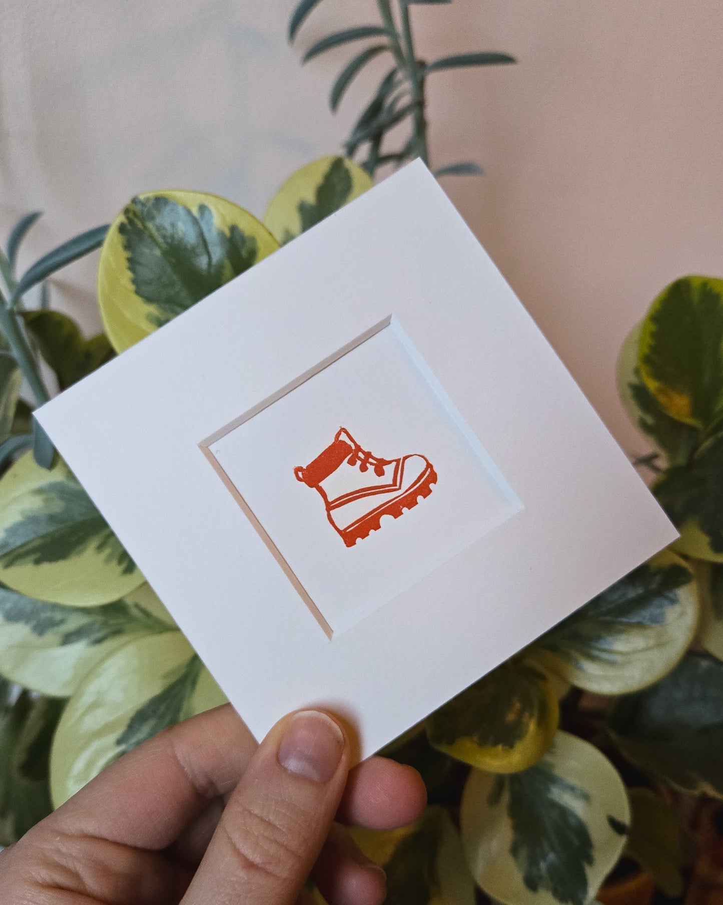 Mini linocut print of an orange hiking boot