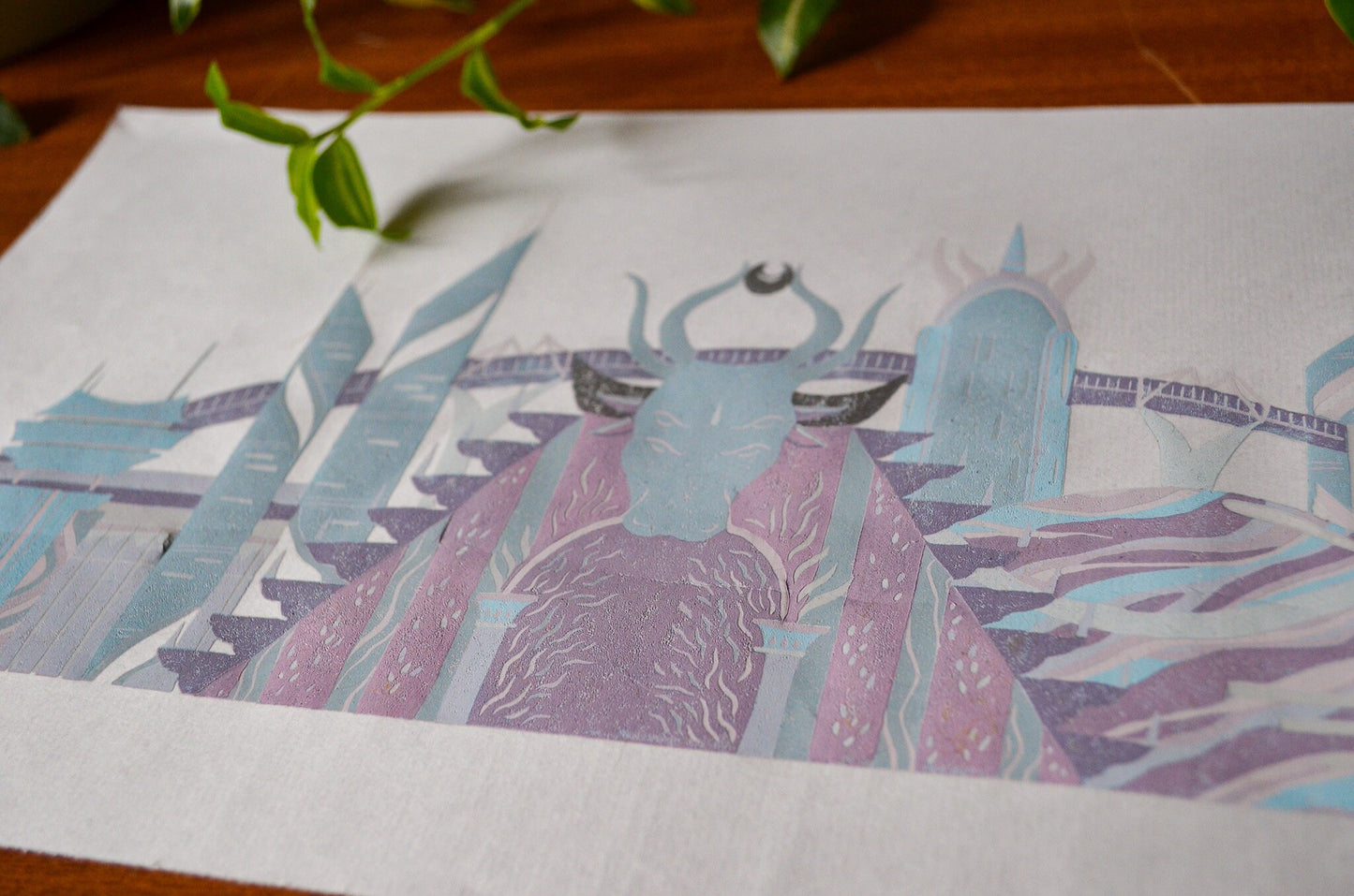 Close up of a pastel coloured linocut print of futuristic sci-fi buildings