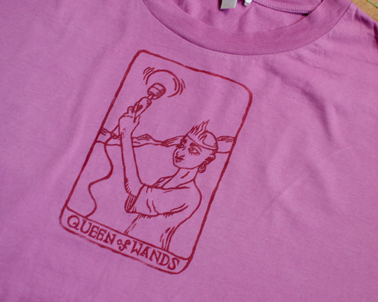 Pink t-shirt with a queen of wands tarot card design.